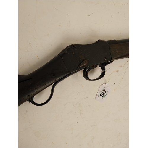 187 - Late 19th. C. single barrel under lever rifle with sight, stock in need of repair, ramrod missing. S... 