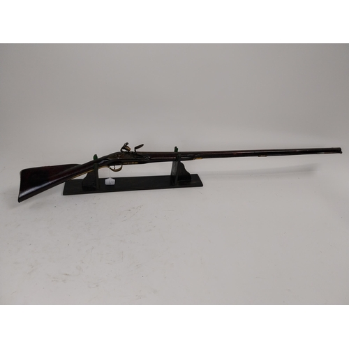 191 - 19th. C. flintlock single barreled sporting shotgun with walnut stock, brass mounts, chased action w... 