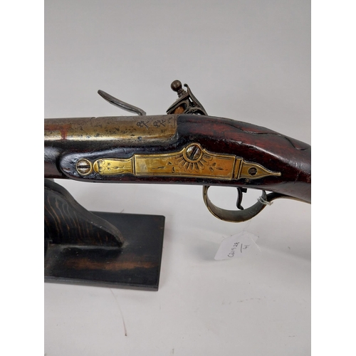 191 - 19th. C. flintlock single barreled sporting shotgun with walnut stock, brass mounts, chased action w... 