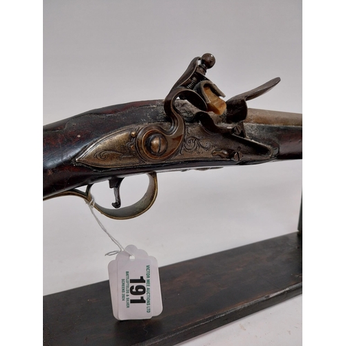 191 - 19th. C. flintlock single barreled sporting shotgun with walnut stock, brass mounts, chased action w... 