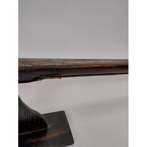 191 - 19th. C. flintlock single barreled sporting shotgun with walnut stock, brass mounts, chased action w... 