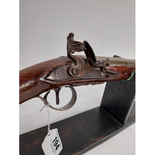 194 - 19th C. Dublin flintlock blunderbuss with brass barrel, belled at the muzzle, walnut stock, brass mo... 