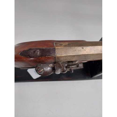 194 - 19th C. Dublin flintlock blunderbuss with brass barrel, belled at the muzzle, walnut stock, brass mo... 