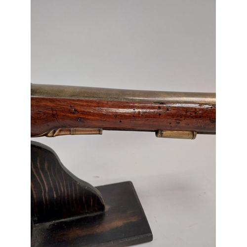 194 - 19th C. Dublin flintlock blunderbuss with brass barrel, belled at the muzzle, walnut stock, brass mo... 