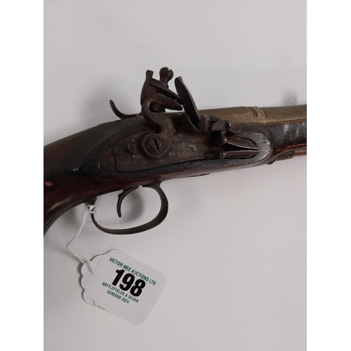 198 - 19th. C. flintlock pistol, walnut stock, chased action, brass barrel, wood & brass ramrod, sprung ba... 