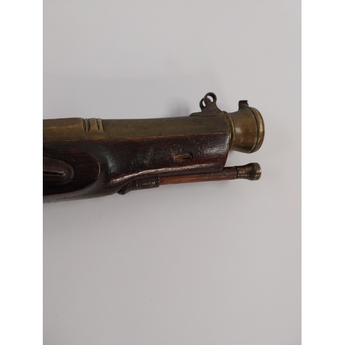 198 - 19th. C. flintlock pistol, walnut stock, chased action, brass barrel, wood & brass ramrod, sprung ba... 