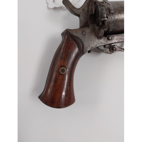 200 - 19th. C. pinfire revolver, with folding trigger with Belgium proof stamps { 17cm L overall. }.