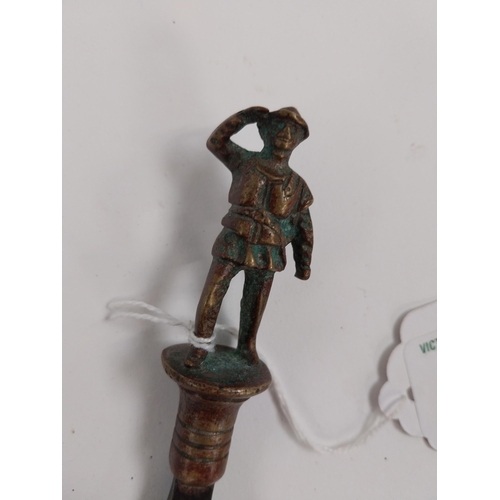 232 - WWI brass and metal bottle opener in the form of a Soldier. {12 cm H x  3 cm Dia.}