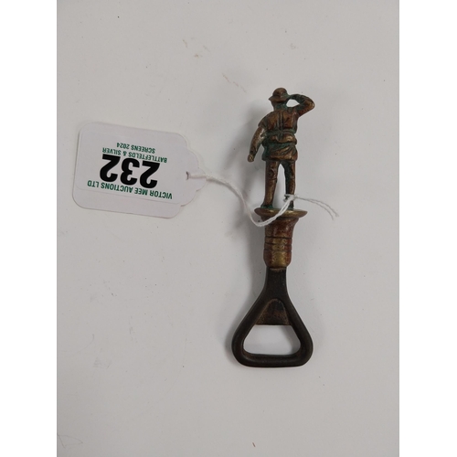 232 - WWI brass and metal bottle opener in the form of a Soldier. {12 cm H x  3 cm Dia.}