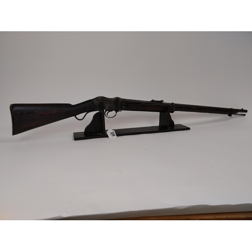 235 - Late 19th. C. single barrel under lever rifle with sight and ramrod.{ 126cm L overall. }.