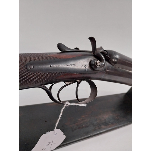 238 - De - commissioned side by side hammer double barrel shotgun, with walnut stock. Stamped T Bland & So... 