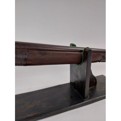 238 - De - commissioned side by side hammer double barrel shotgun, with walnut stock. Stamped T Bland & So... 