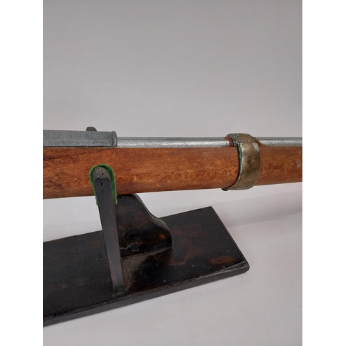 251 - Replica flintlock rifle. {147 cm L x 15 cm H}.