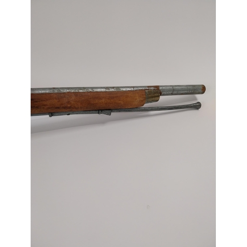 251 - Replica flintlock rifle. {147 cm L x 15 cm H}.