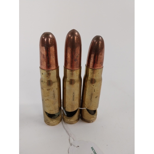 257 - Three brass and copper bullets.