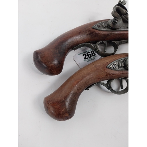 268 - Pair of reproduction flintlock pistols. { 37cm L overall. }.