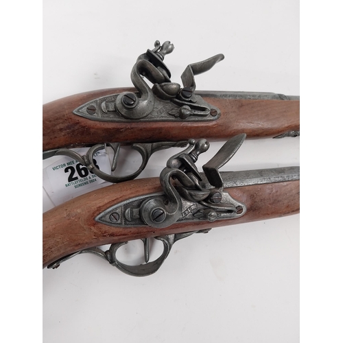 268 - Pair of reproduction flintlock pistols. { 37cm L overall. }.