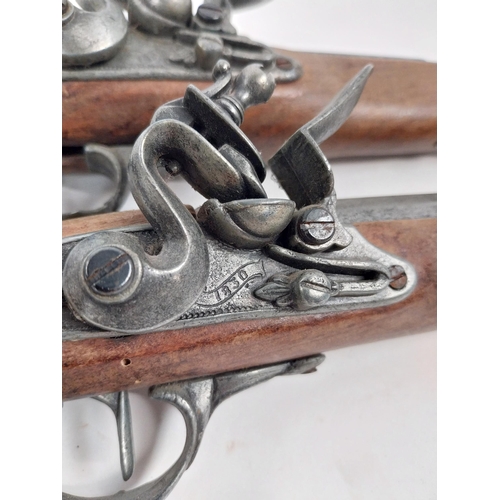 268 - Pair of reproduction flintlock pistols. { 37cm L overall. }.