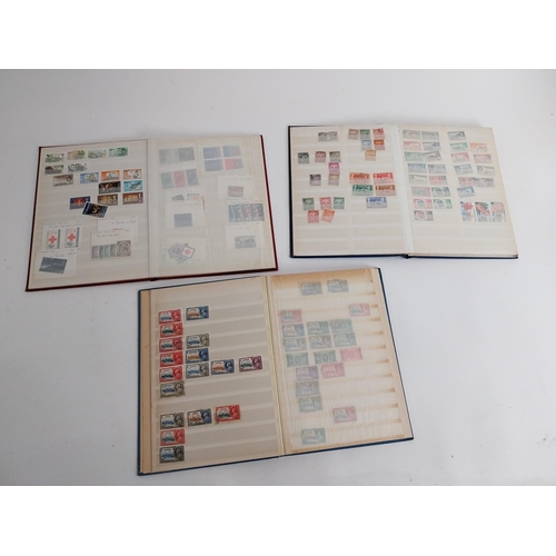 320 - Three Books of British Commonwealth stamps 1900-1970 some over stamped with WAR TAX .