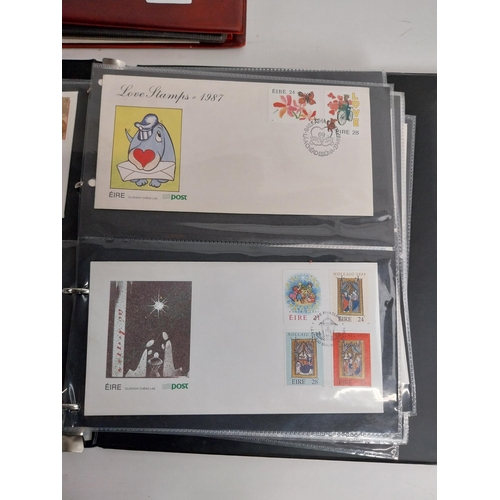 329 - Two Irish, British and Commonwealth first day covers and unfranked stamps in albums.