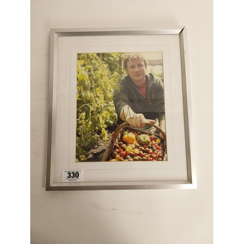 330 - Signed framed photograph of Celebrity Chef Jamie Oliver with certificate of authenticity on back.