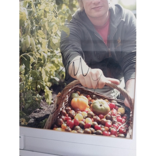 330 - Signed framed photograph of Celebrity Chef Jamie Oliver with certificate of authenticity on back.