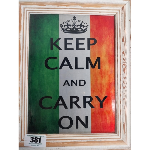 381 - Framed Aluminium Keep Calm and Carry On sign. {35 cm H x 27 cm W}.