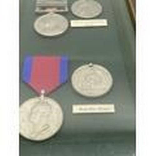 396 - Set of replica Waterloo & Queen's South Africa medals with ribbons mounted in a glazed case.