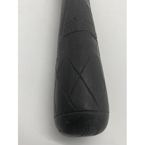 397 - Hand carved bog oak truncheon decorated with shamrocks, harp and diamond design and engraved From Be... 