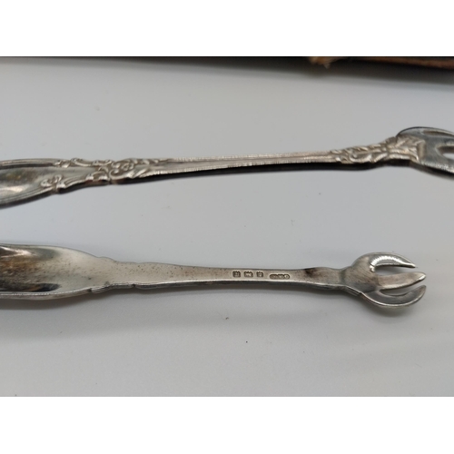 501 - Set of 10 English Teaspoons and sugar tongs Hallmarked in Birmingham 1915 194g GM&C0