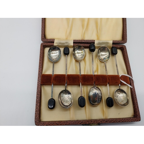 509 - Set of six English silver coffee spoons with coffee bean terminals,  in presentation case. Hallmarke... 