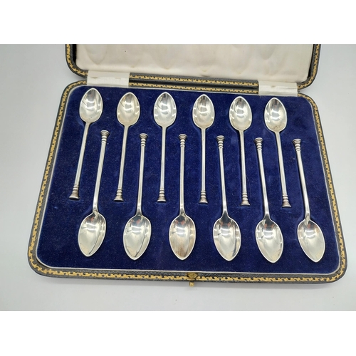 519 - English silver set of twelve coffee spoons in original presentation case.  Hallmarked in Sheffield 1... 