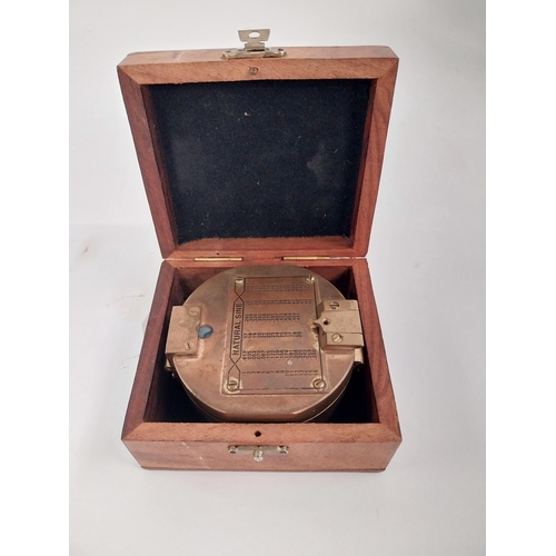 59 - Cased brass Natural Sine Compass. {6 cm H x 10 cm W  x 9 cm D}.