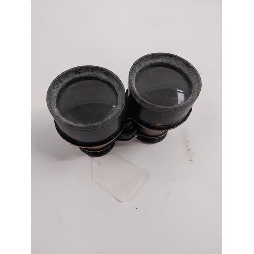 66 - Pair of WWI binoculars. {9 cm H x 15 cm W}