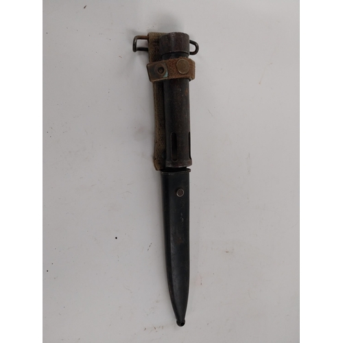 83 - 20th C. rifle bayonet with original metal scabbard. {23 cm L}.