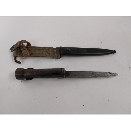 83 - 20th C. rifle bayonet with original metal scabbard. {23 cm L}.