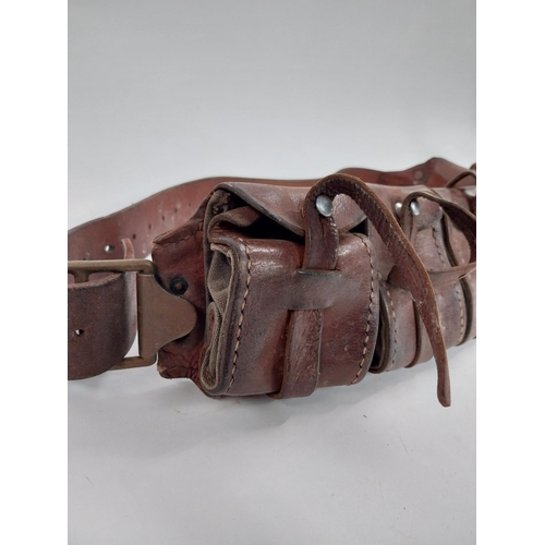 84 - Early 20th C. leather bullet belt. {51 cm L}.