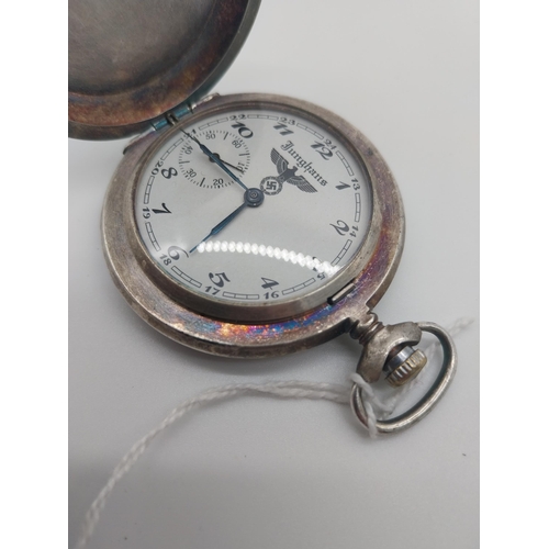 112 - German WWII Military Pocket Watch by Junghans, the white metal case with embossed swastika, the vers... 