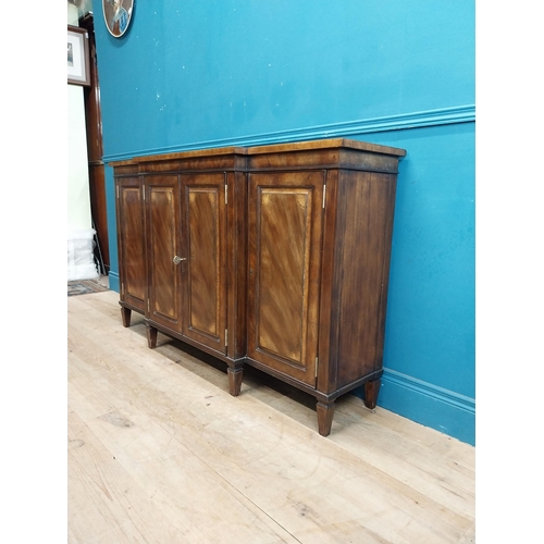 12 - Good quality mahogany and satinwood side cabinet in the Regency style with four doors on short taper... 