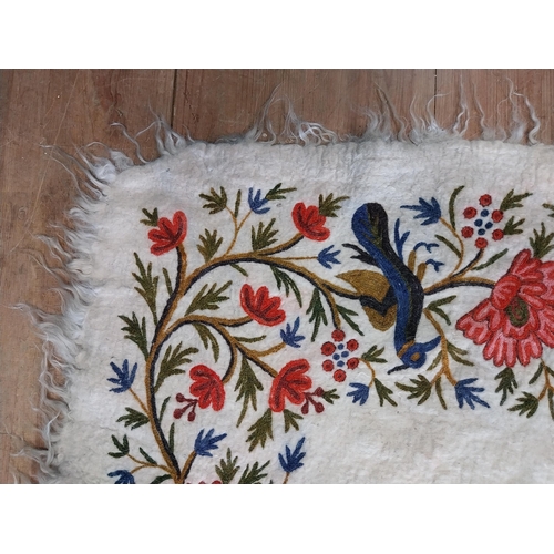 28 - Decorative woollen rug decorated with birds.