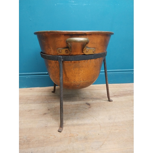 3 - Early 20th C. copper and metal log bucket with two handles on tripod base. {}