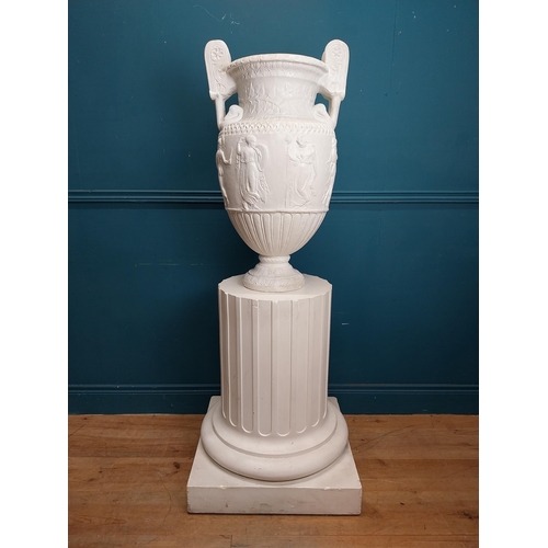 61 - 20th C. Grand Tour plaster Grecian Urn on Pedestal. {147 cm H x 56 cm W x 56 cm D}.