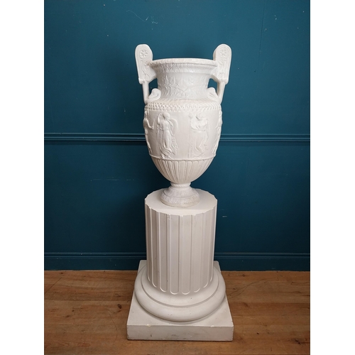 61 - 20th C. Grand Tour plaster Grecian Urn on Pedestal. {147 cm H x 56 cm W x 56 cm D}.