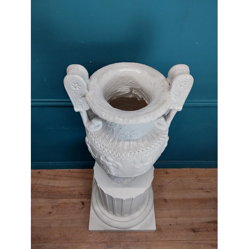 61 - 20th C. Grand Tour plaster Grecian Urn on Pedestal. {147 cm H x 56 cm W x 56 cm D}.