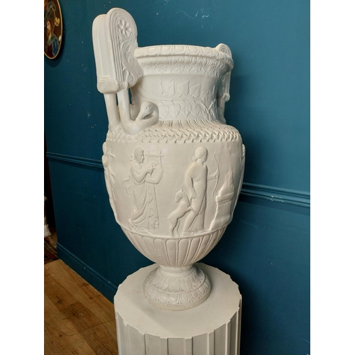 61 - 20th C. Grand Tour plaster Grecian Urn on Pedestal. {147 cm H x 56 cm W x 56 cm D}.