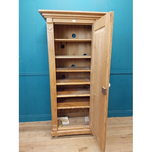 64 - Stripped pine single door kitchen cupboard with six graduated inner shelves. {188 cm H x 88 cm W x 5... 