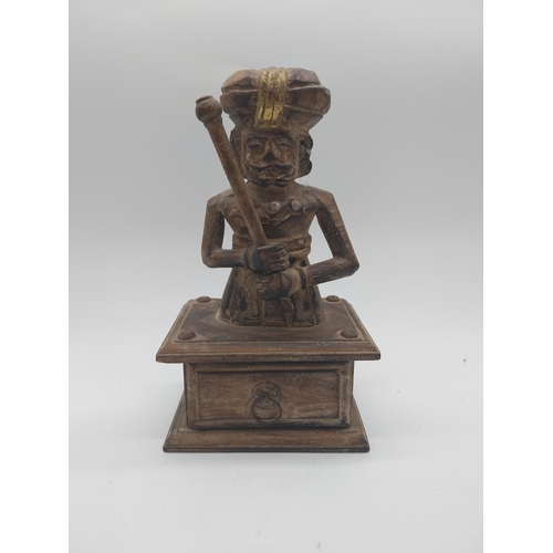 866 - Carved hardwood Turkish figure with drawer. {27 cm H x 16 cm W x 10 cm D}.