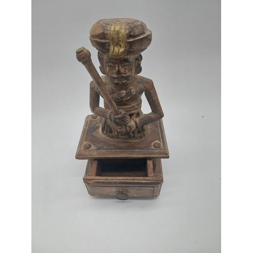 866 - Carved hardwood Turkish figure with drawer. {27 cm H x 16 cm W x 10 cm D}.