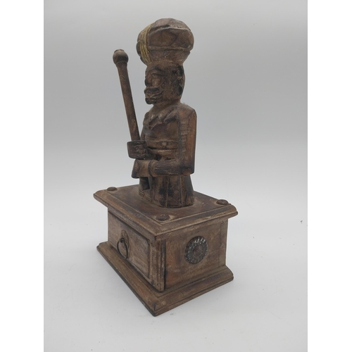 866 - Carved hardwood Turkish figure with drawer. {27 cm H x 16 cm W x 10 cm D}.