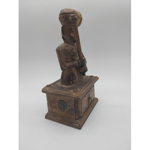 866 - Carved hardwood Turkish figure with drawer. {27 cm H x 16 cm W x 10 cm D}.